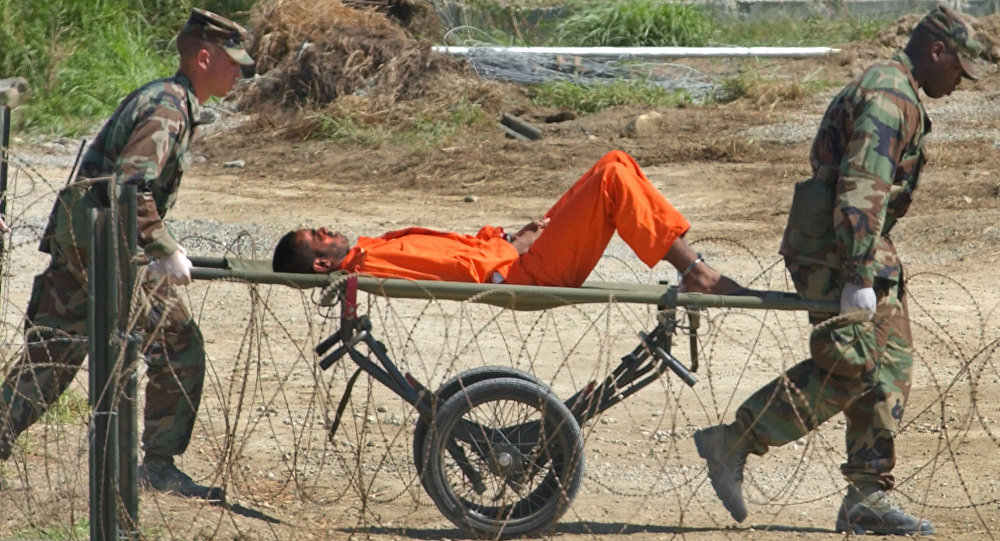 В отчете говорится, что еще троих заключенных Гуантанамо разрешили освободить