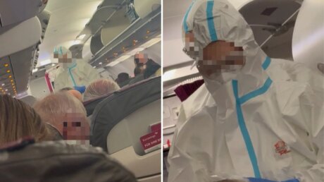 Медики в защитных костюмах поднялись на борт самолёта в Дюссельдорфе после вспышки предполагаемого норовируса